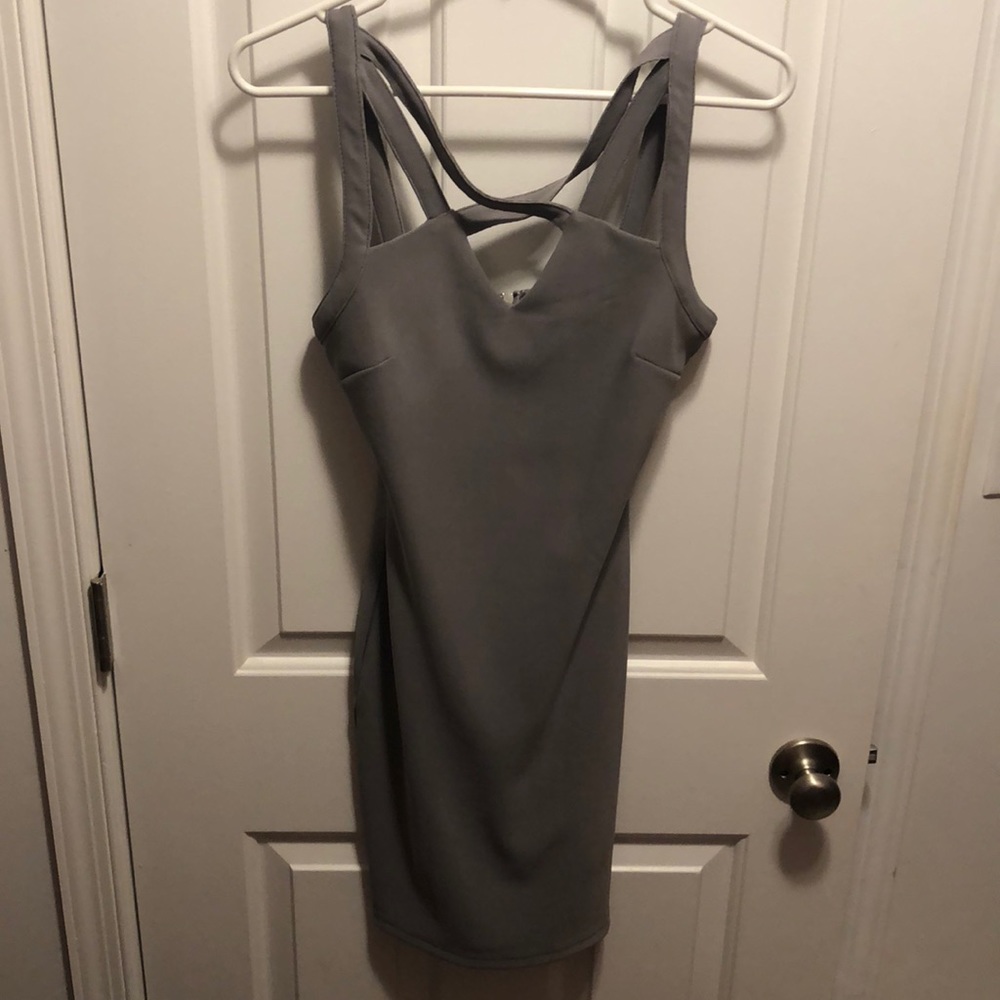 Form fitting gray dress with cross cross neck